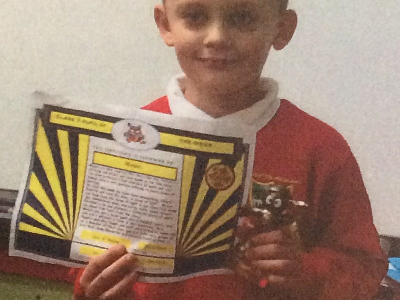 Mason receiving his pupil of the week award